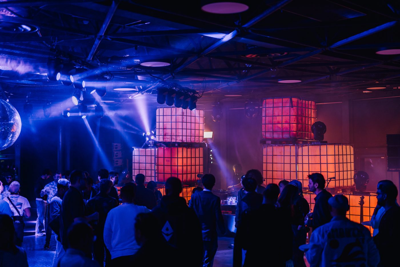 The crowd at the afterparty, glowing cube installation and disco ball